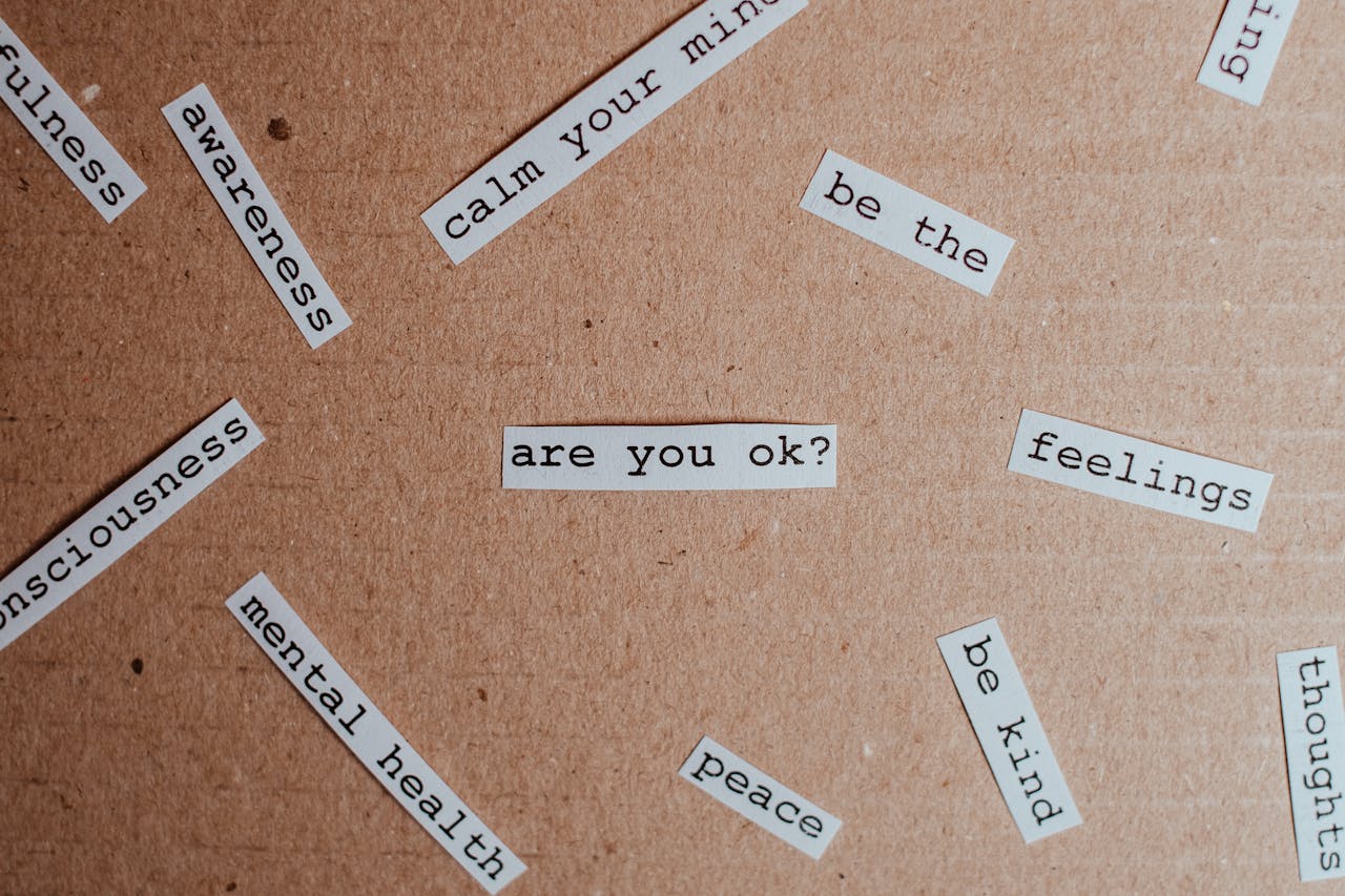 about-01 Cut-out words promoting mental health awareness on cardboard background.